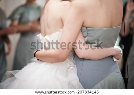 Girls hug her friend