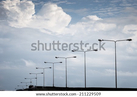 street lamp on cloudy daylight
