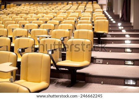 Row of yellow seat in auditorium