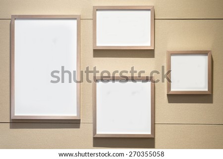 4 Blank white paper canvas photo  frame on the pastel wall for a bulletin
