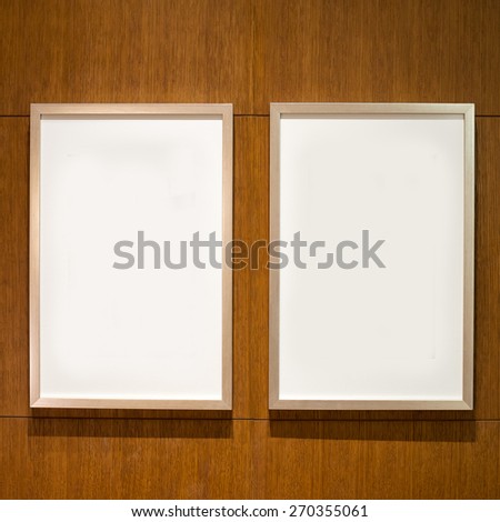 2 Blank white paper canvas photo  frame on the wood wall for a bulletin