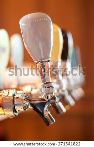 Beer tap in a row - fine belgium brewery in restaurant