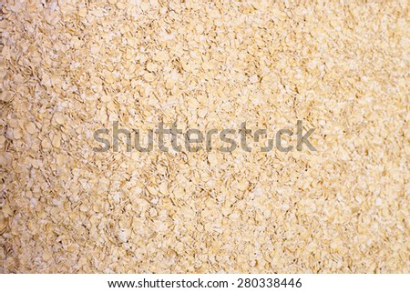 Oat flakes pile from above view for food background