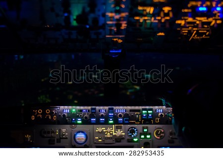 beautiful light from airplane console in pilot cockpit - night view