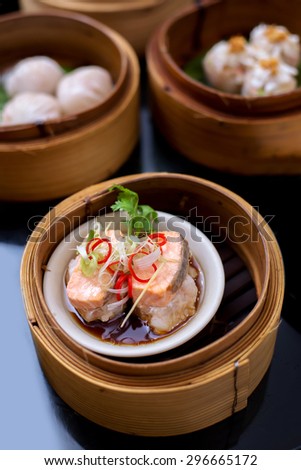 yumcha, steamed dumpling , Salmon dim sum in bamboo steamer of chinese restaurant