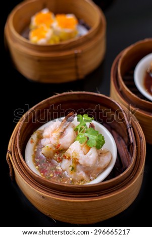 yumcha, steamed dumpling , shrimp dim sum in bamboo steamer of chinese restaurant