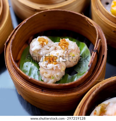 yumcha, steamed dumpling , crab shumai dim sum in bamboo steamer of chinese restaurant