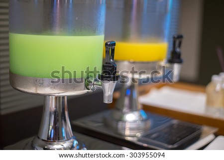 Closeup of Guava and Orange juice in water cooler for guess of seminar in the hotel