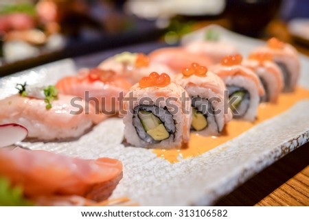 Japanese salmon dishes with salmon rolls , salmon sushi and salmon yome