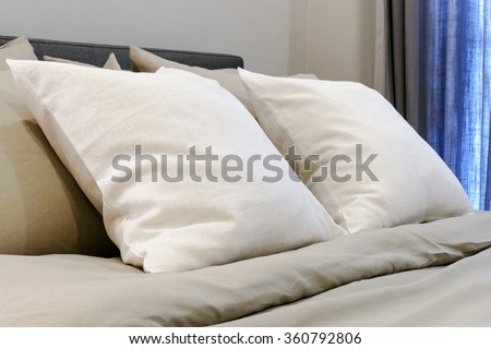 white soft pillows on the comfortable  bed