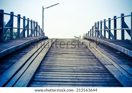 Vintage blue style,An old bridge made from timber in thailand