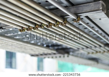 An image of a lot of pipe lines for mechanical, water, electricity, gas, fuel, drainage fire system