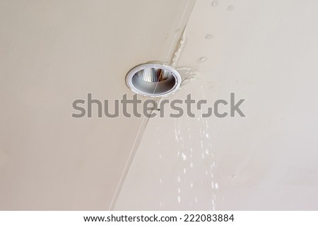 Water leaking from ceiling near the lamp