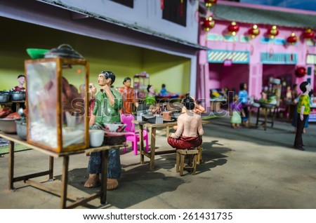 BANGKOK , THAILAND - MARCH 8, 2015 : Mini colorful clay dolls shown the way of life in the pass of Thai people.Street food. Display at the market named 