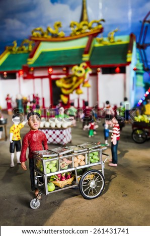 BANGKOK , THAILAND - MARCH 8, 2015 : Mini colorful clay dolls shown the way of life in the pass of Thai people.Street food. Display at the market named 