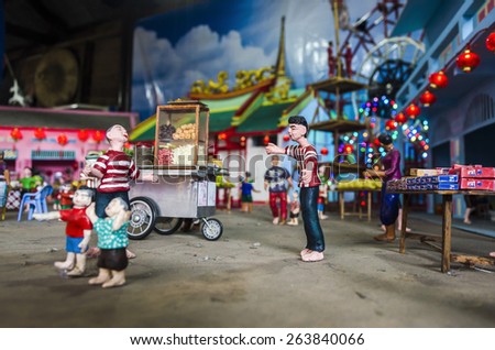 BANGKOK , THAILAND - MARCH 8, 2015 : Mini colorful clay dolls shown the way of life in the pass of Thai people.Street food. Display at the market named \