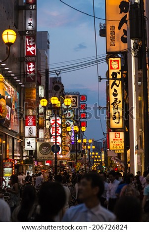 OSAKA,JAPAN- JULY 22: Twilight view of the neon advertisements Dotonbori on Jul 22, 2013 in Osaka, Japan.Is famous for its historic theatres,and restaurants, and its many neon and mechanised signs