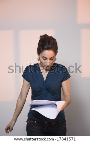 Woman at audition, reading script