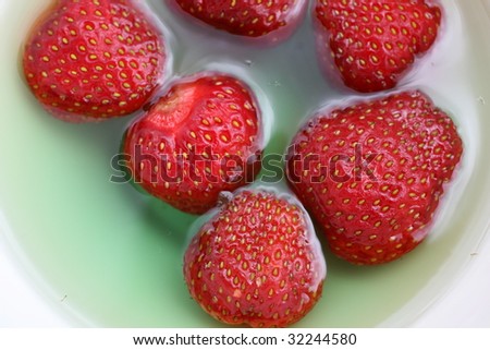 strawberries in green jelly