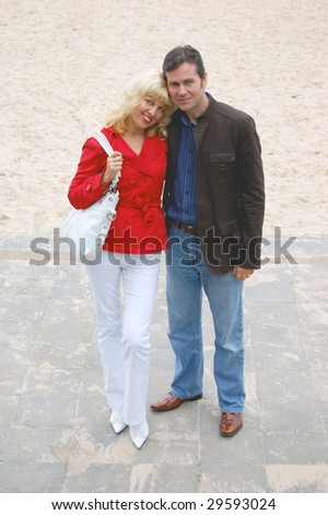 Beautiful couple hugging on the beach