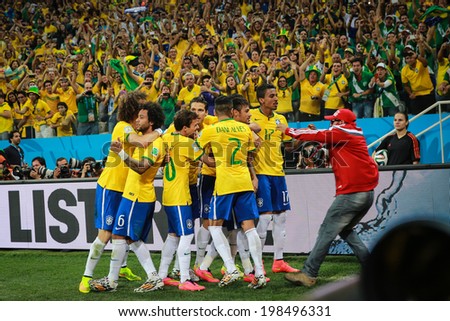 SAO PAULO, BRAZIL - June 12, 2014: Brazil team celebrates after Neymar\'s goal during the World Cup Group A opening game between Brazil and Croatia at Corinthians Arena. No Use in Brazil.