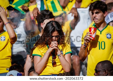 BELO HORIZONTE, BRAZIL - June 28, 2014: Brazil soccer fans hoping for a win at the 2014 World Cup Round of 16 game between Brazil and Chile at Mineirao Stadium. No Use in Brazil.