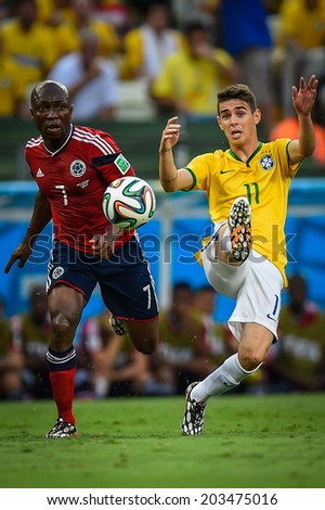 FORTALEZA, BRAZIL - July 4, 2014: Oscar of Brazil competes for the ball during the FIFA 2014 World Cup quarter-finals game between Brazil and Colombia at Estadio Castelao. NO USE IN BRAZIL.