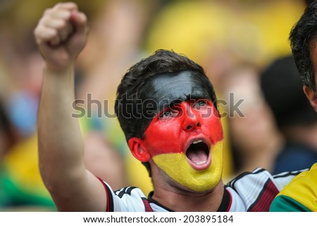 BELO HORIZONTE, BRAZIL - July 8, 2014: Germany soccer fans celebrating at the 2014 World Cup Semi-finals game between Brazil and Germany at Mineirao Stadium. NO USE IN BRAZIL.