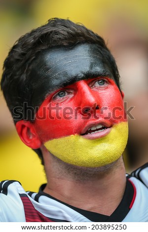 BELO HORIZONTE, BRAZIL - July 8, 2014: Germany soccer fans celebrating at the 2014 World Cup Semi-finals game between Brazil and Germany at Mineirao Stadium. NO USE IN BRAZIL.