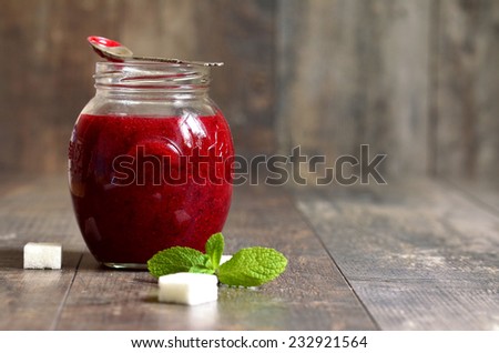 Cranberry mashed with sugar in a jar.