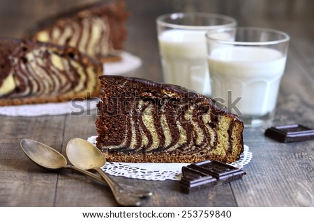Piece of \'\'Zebra\'\' cake with chocolate glaze.