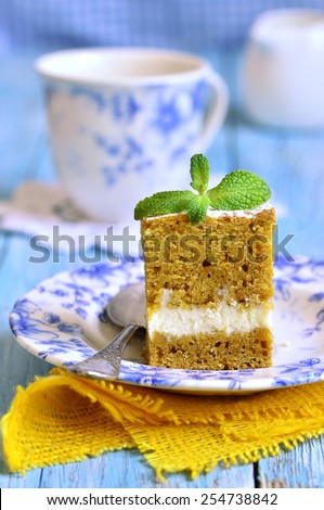 Piece of carrot cake with butter and ricotta cream.