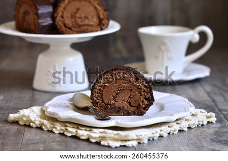 Chocolate biscuit roll with chocolate cream.