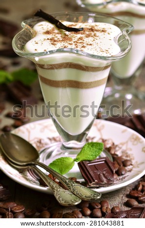 Vanilla pannacotta with coffee and chocolate - traditional italian dessert.