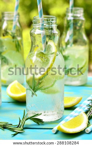 Citrus fizz with rosemary in a bottle.