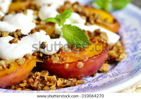 Grilled peaches with granola and whipped cream for breakfast.