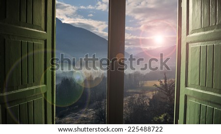 View through an open window onto beautiful landscape