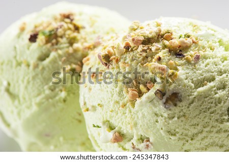 Scoops of pistachio ice cream with pistachios