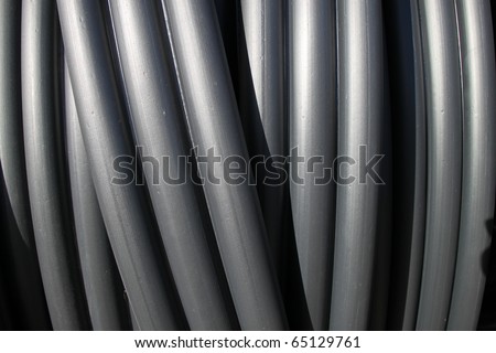 Black plastic tubes - construction site objects. PVC sewer pipes.