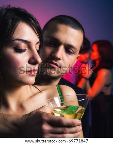 stock photo Sensual couples drinking dancing and celebrating