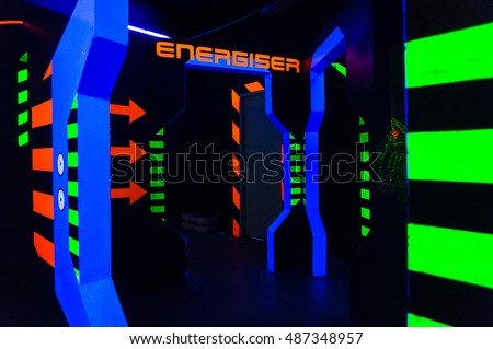 Laser tag play arena with fluorescent paint, energiser room