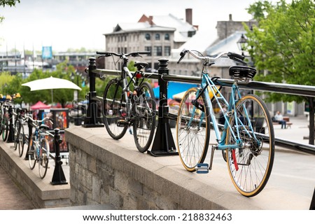 Montreal, Canada - May 23, 2014: Bicycles locked to railings in historic city setting