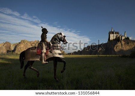 Knight on horseback, castle in distance atop rocks