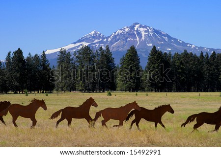 Silhouettes of horse sculpture and mountains near Sisters Oregon