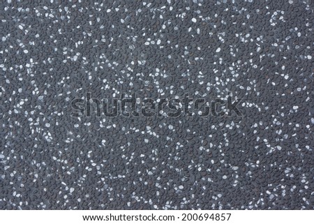 Dark Gray Stone Floor Made of Small Gravels of White, Gray and  Black Colors.