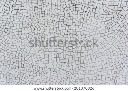 Wall Covered with Irregular Mosaics of White, Very Light Green and Very Light Yellow Color