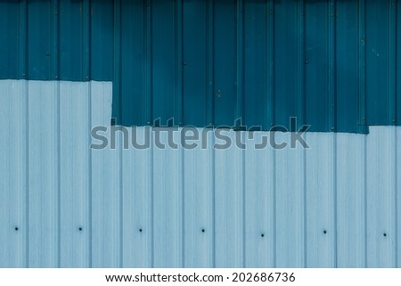 Patched Corrugated Metal Sheet with Navy Blue and Powder Blue Color