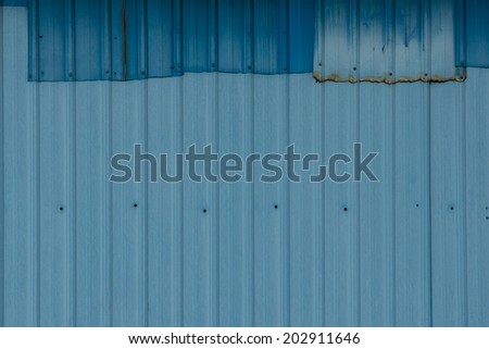 Patched Corrugated Metal Sheet with Navy Blue and Powder Blue
