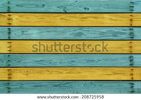 Wood Planks with Alternating Bright Blue and Yellow Colors