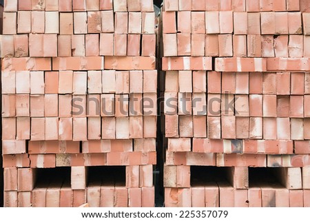 Two Stack of Nicely Stacked Bricks. Ready for Construction Projects. With Two Holes Near The Base of Each Stack
